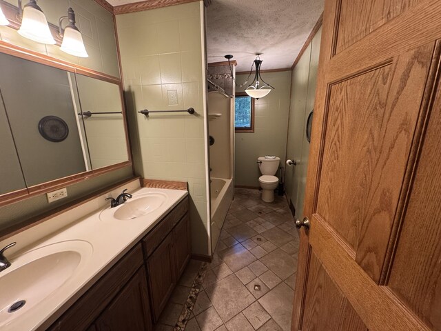19084 200th Ave, Tustin, MI 49688 - full bathroom featuring double vanity, shower / bath combination, ornamental molding, and a textured ceiling