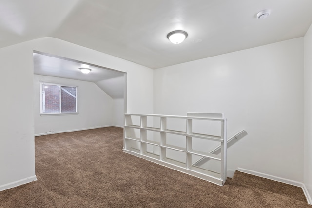 bonus room with carpet floors, lofted ceiling, and baseboards