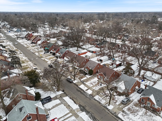 snowy aerial view featuring a residential view