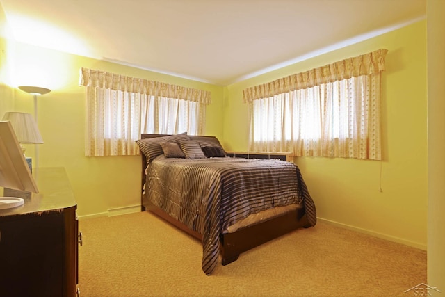 carpeted bedroom with baseboards