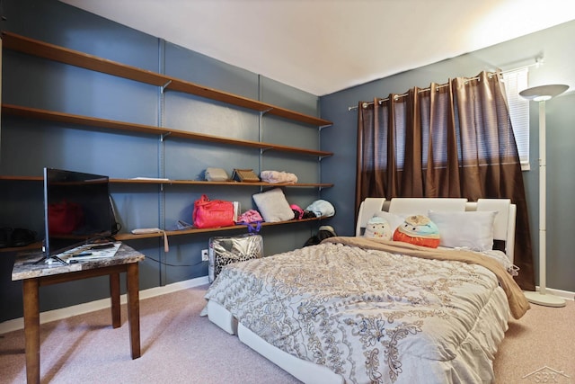 carpeted bedroom with baseboards