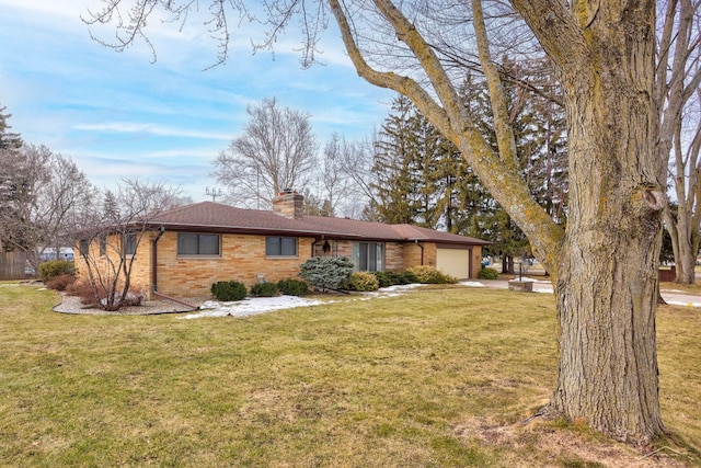 ranch-style home featuring brick siding, a chimney, a garage, driveway, and a front lawn