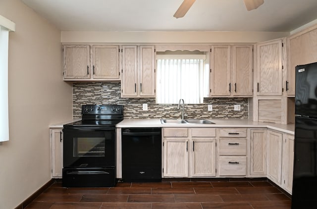 kitchen with black appliances, light countertops, wood tiled floor, and a sink