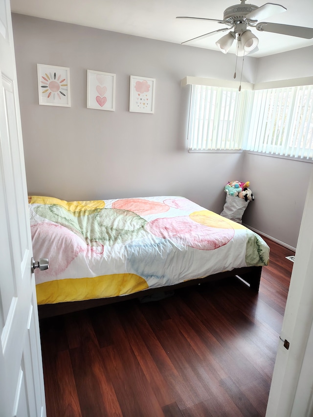 bedroom with a ceiling fan and wood finished floors