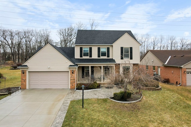 traditional-style house with a porch, a front yard, brick siding, and an attached garage