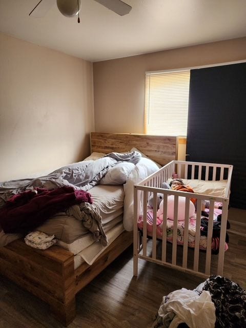 bedroom with ceiling fan and wood finished floors