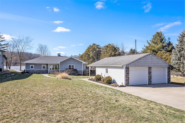 single story home with a garage, stone siding, a front lawn, and an outbuilding