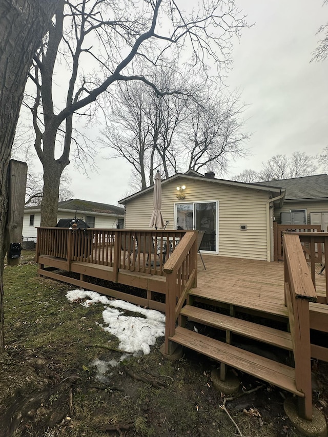 back of property featuring a deck