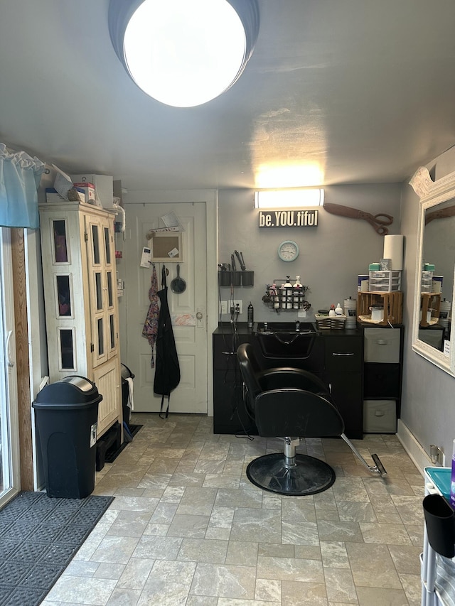 washroom with stone finish floor