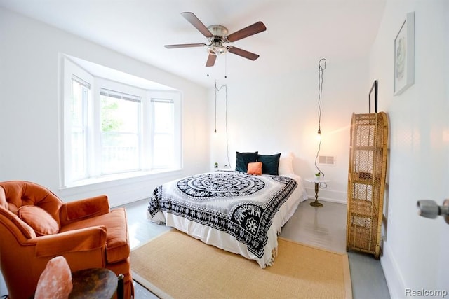 bedroom with visible vents, baseboards, and a ceiling fan