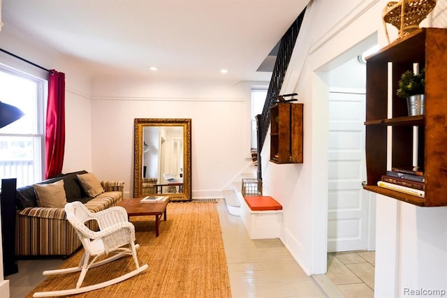 interior space with stairs, baseboards, a wealth of natural light, and recessed lighting