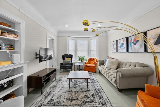 living area with wood finished floors and recessed lighting