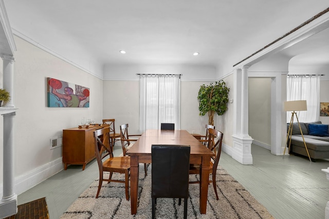 dining space with recessed lighting, baseboards, visible vents, and ornate columns