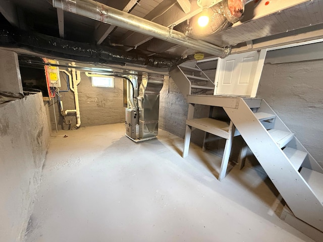 basement featuring heating unit