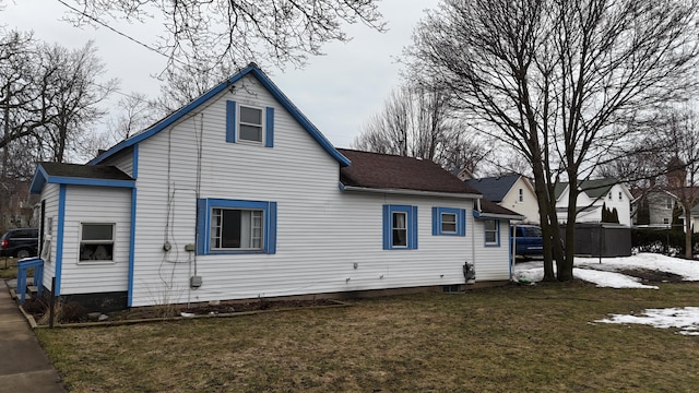 rear view of house with a lawn