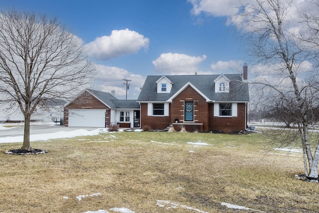 cape cod house with a garage, driveway, a front lawn, and brick siding