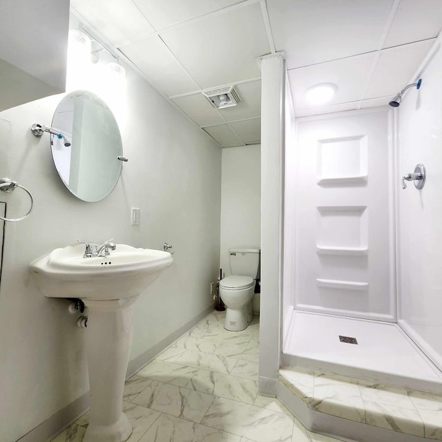 full bath with toilet, visible vents, baseboards, marble finish floor, and a shower stall