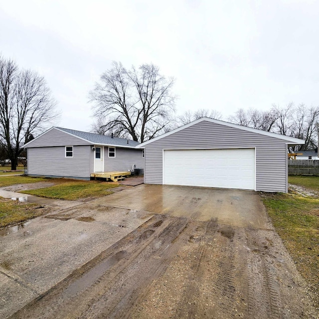 view of front of house with a garage and an outdoor structure