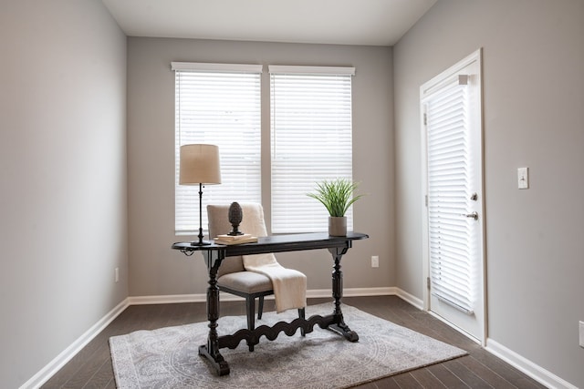 office area with a wealth of natural light and dark wood-type flooring