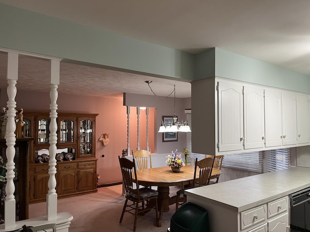 dining space with a chandelier and light carpet