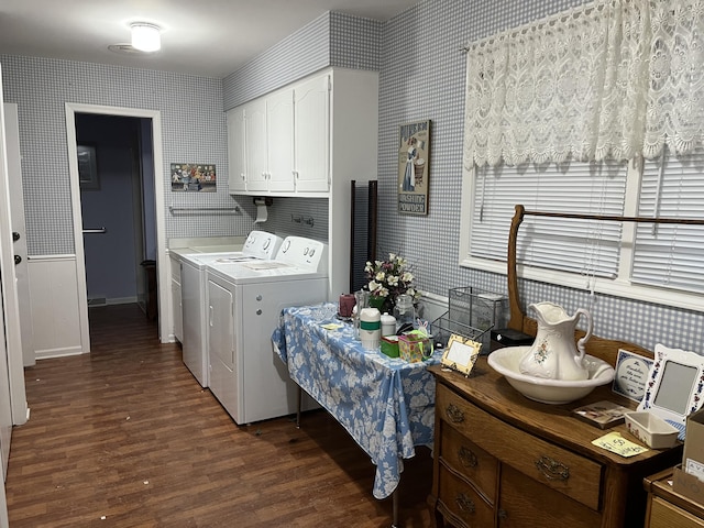 laundry area featuring cabinet space, dark wood finished floors, washer and clothes dryer, and wallpapered walls