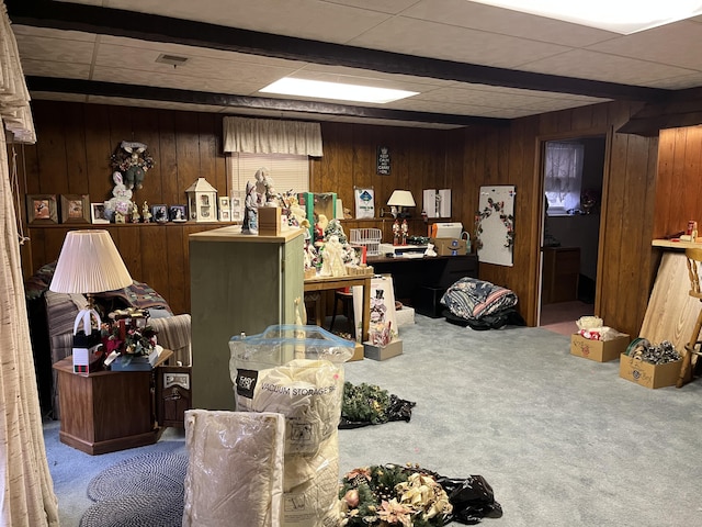 interior space featuring carpet flooring and wood walls