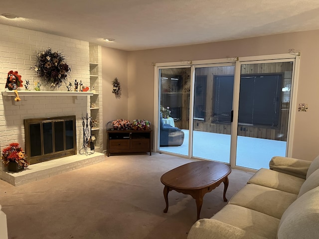 living area featuring carpet and a fireplace