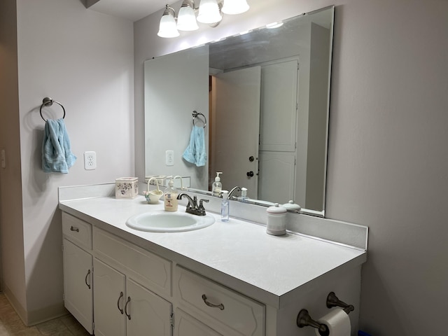 bathroom with vanity and baseboards