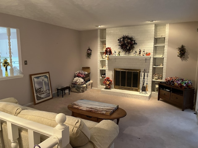 carpeted living area featuring a brick fireplace