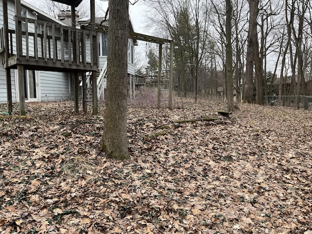 view of yard featuring stairs and a deck