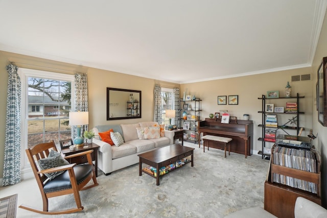 living room featuring visible vents, a wealth of natural light, and crown molding