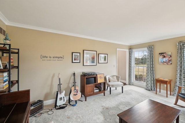 living area featuring carpet floors, baseboards, and crown molding