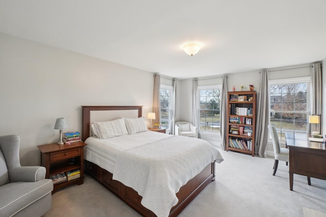 bedroom featuring light colored carpet