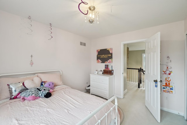 bedroom featuring baseboards, visible vents, a chandelier, and light colored carpet