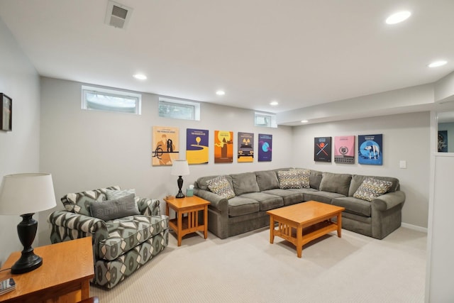 carpeted living area featuring visible vents and recessed lighting