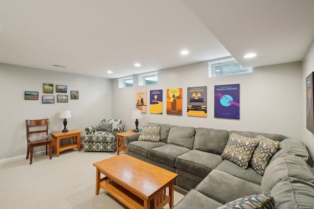 living room with a wealth of natural light, light colored carpet, baseboards, and recessed lighting