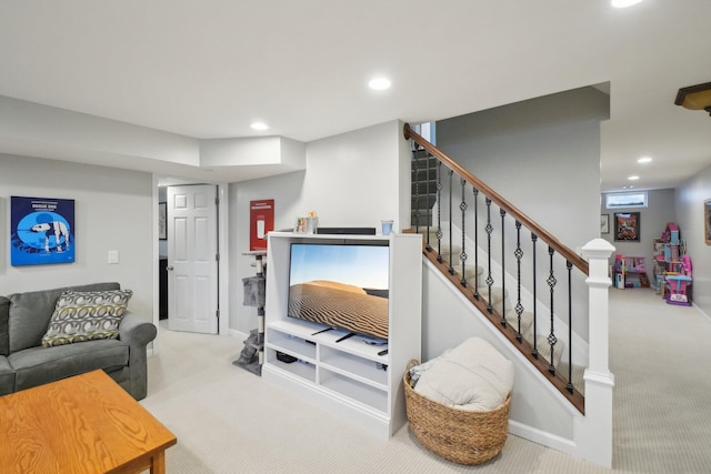 carpeted living room featuring baseboards, stairway, and recessed lighting