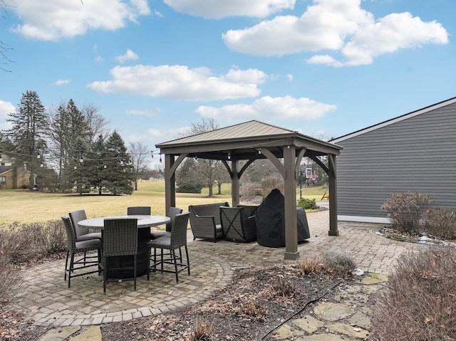 view of patio / terrace with outdoor dining space and a gazebo