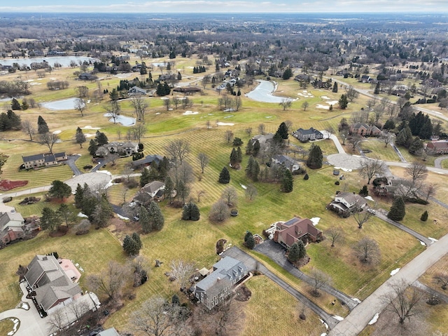 drone / aerial view featuring a water view and a residential view