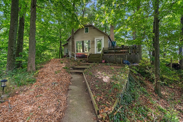 rear view of property with a wooden deck