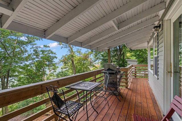 wooden deck featuring area for grilling