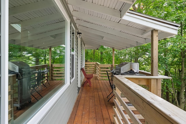 wooden terrace featuring area for grilling