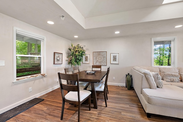 dining space with recessed lighting, wood finished floors, and baseboards