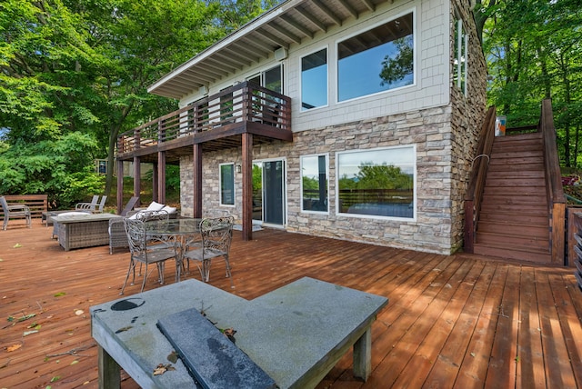 wooden deck with stairs and outdoor dining space