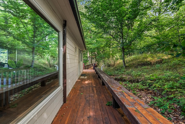 wooden terrace with a forest view