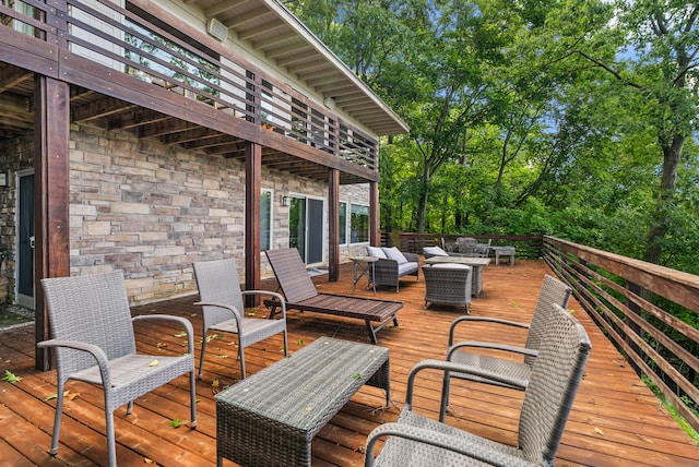 wooden terrace featuring outdoor lounge area