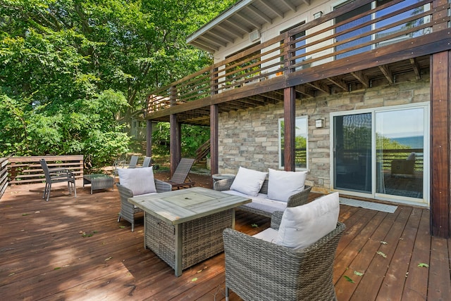 wooden deck featuring an outdoor living space