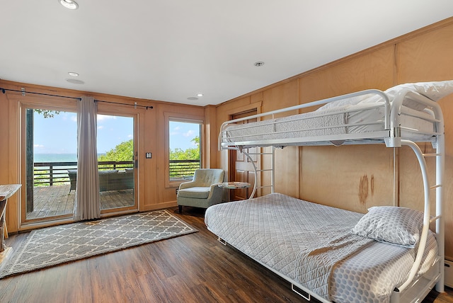 bedroom featuring access to exterior, recessed lighting, and wood finished floors