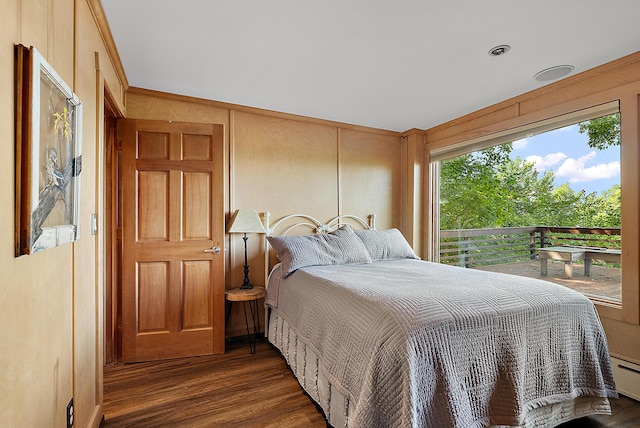 bedroom with dark wood finished floors