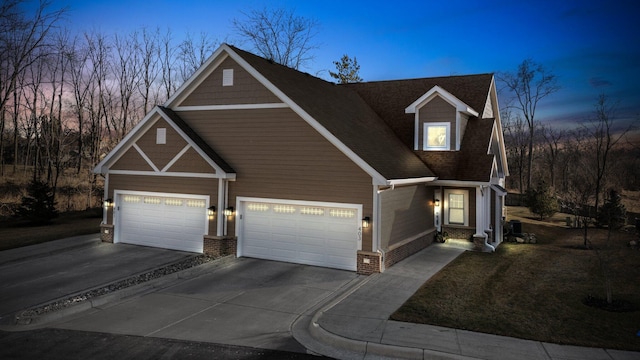 view of front facade featuring an attached garage and concrete driveway